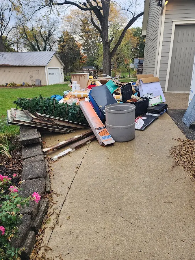 Dumpster being loaded with debris for 30 Yard Dumpster Rental in Tewksbury
